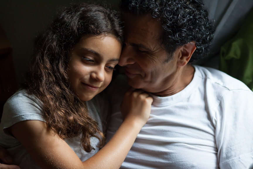 Portrait of father and daughter during family photo session at home by Marili Clark Photographer.