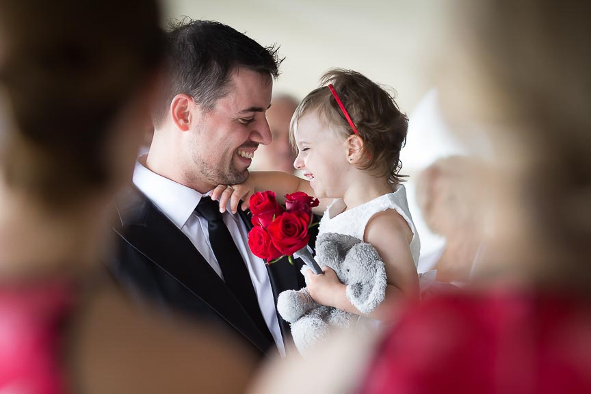 Photo of father and daughter during a wedding by Marili Clark Photographer.