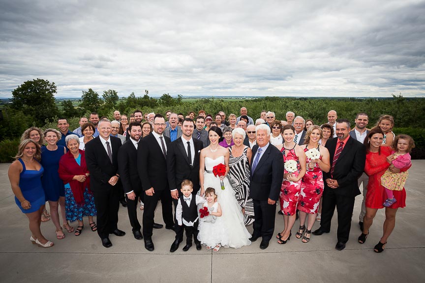 Group photo of family and friends during wedding by Marili Clark Photographer.