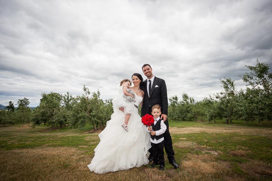 Photo of bride and groom and their kids by Marili Clark Photographer.