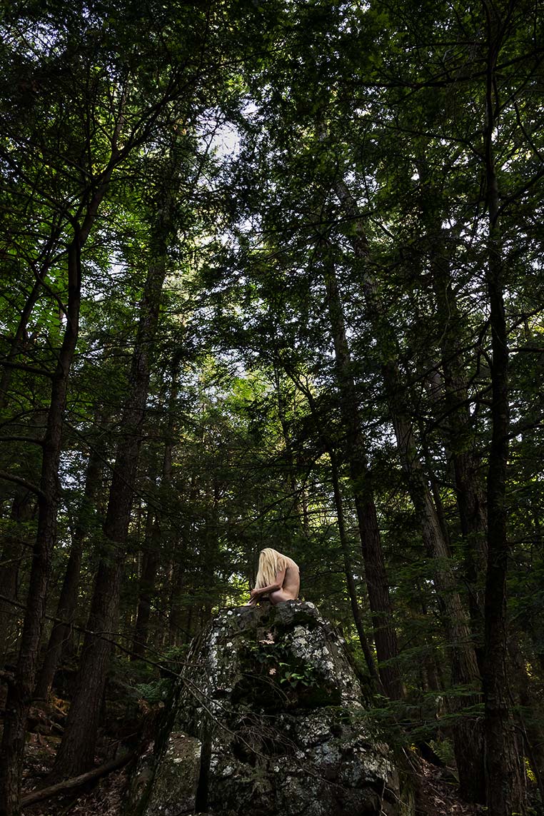 Le Repos de la Guerrière - The Mountain - Woman sitting on a giant rock in the forest.