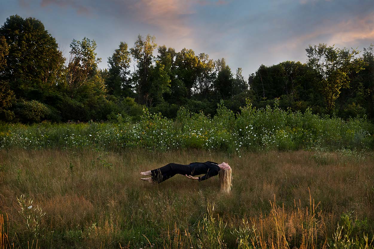 Le Repos de la Guerrière - Dreaming - Woman floating over the flowers in a field at sunset.