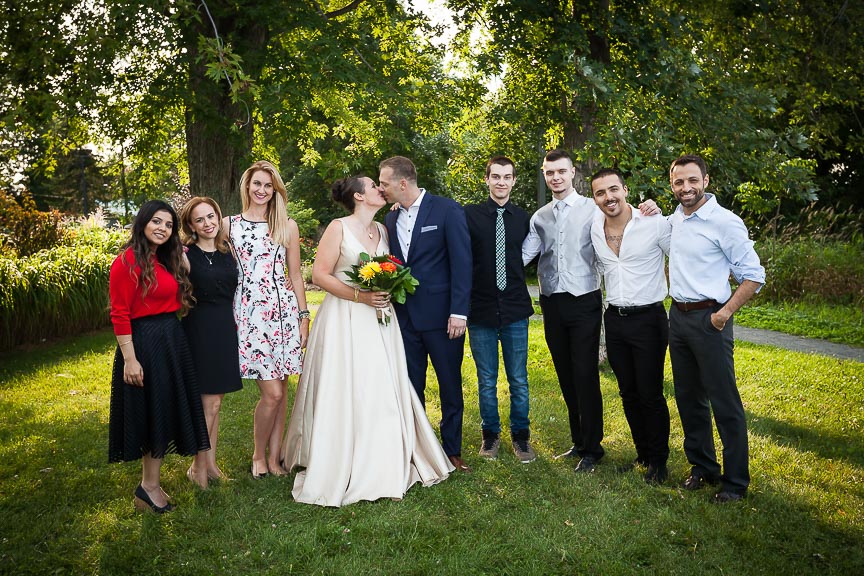 Photo of bride and groom with family and friends by Marili Clark Photographer.